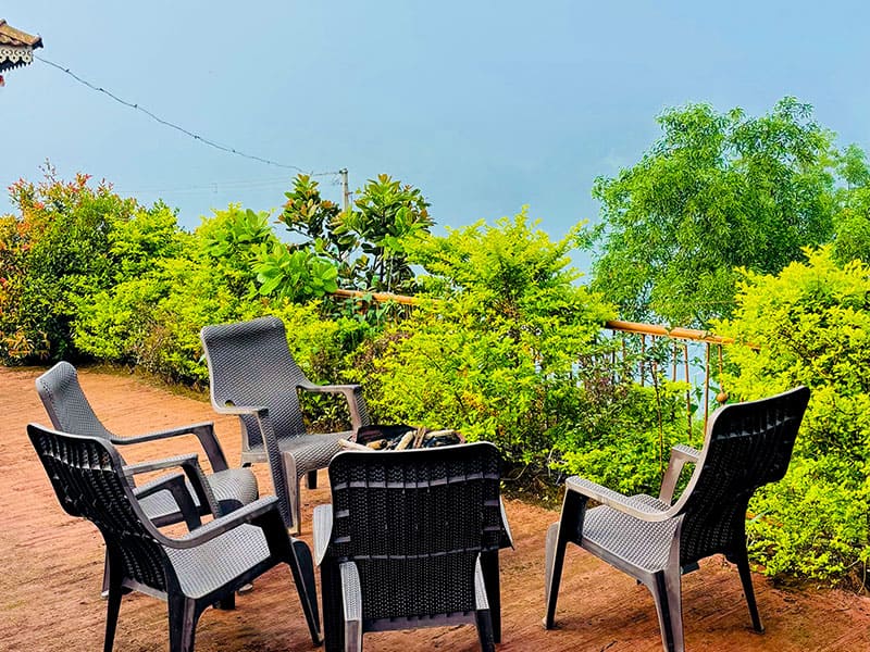 Outdoor garden view of Andur Lakeview Resort with greenery and walking path