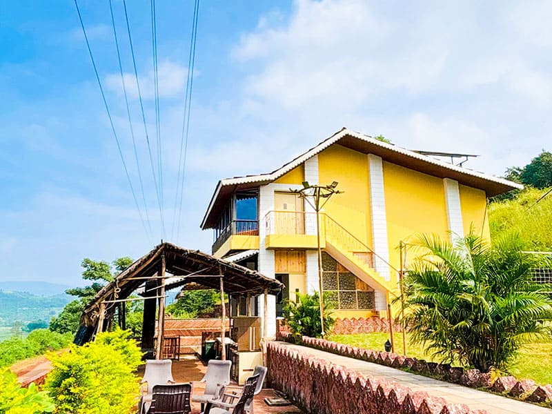 Outdoor garden view of Andur Lakeview Resort with greenery and walking path