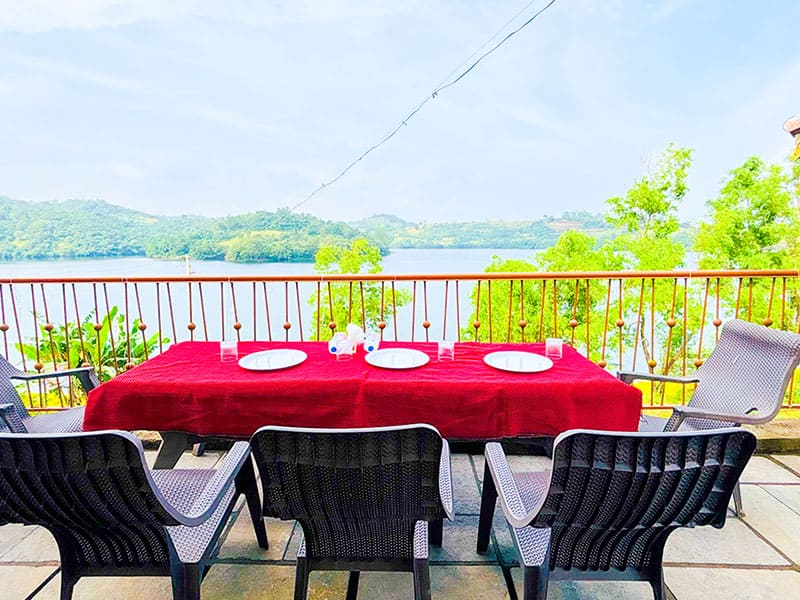 Outdoor garden view of Andur Lakeview Resort with greenery and walking path