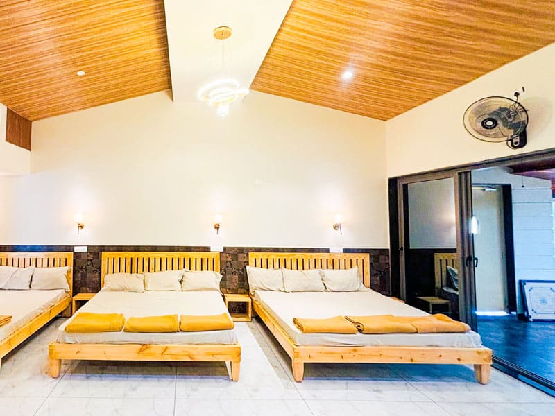 Deluxe room at Andur Lakeview Resort with lake view and comfortable bedding