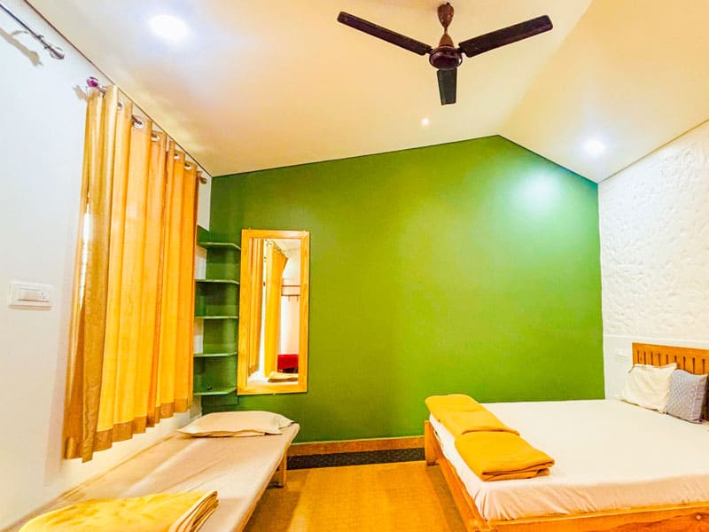 Deluxe room at Andur Lakeview Resort with lake view and comfortable bedding