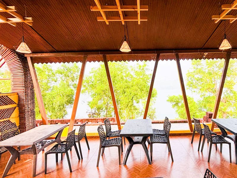 Deluxe room at Andur Lakeview Resort with lake view and comfortable bedding