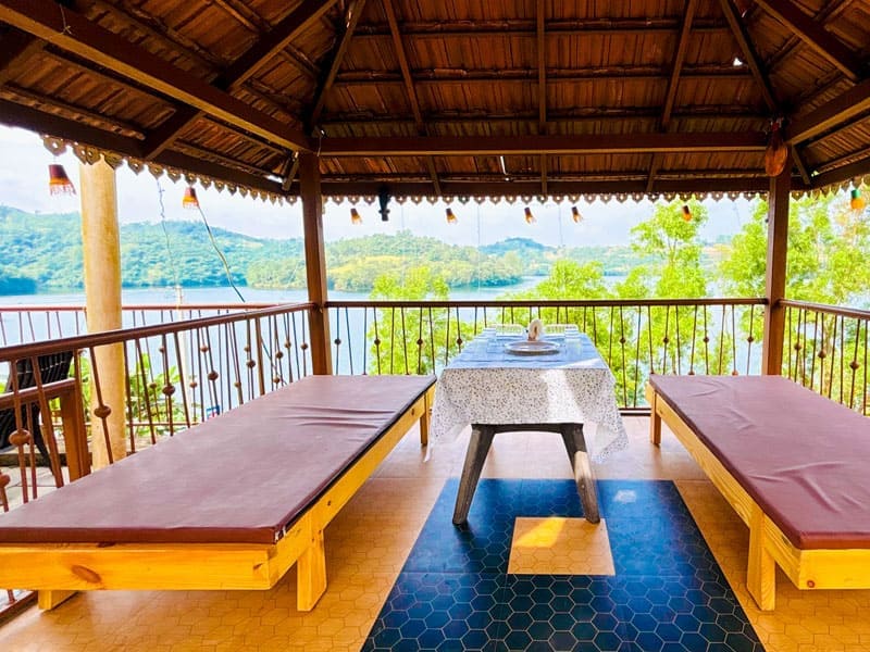 Lawn and sports area at Andur Lakeview Resort featuring open green space, outdoor games, and relaxing seating