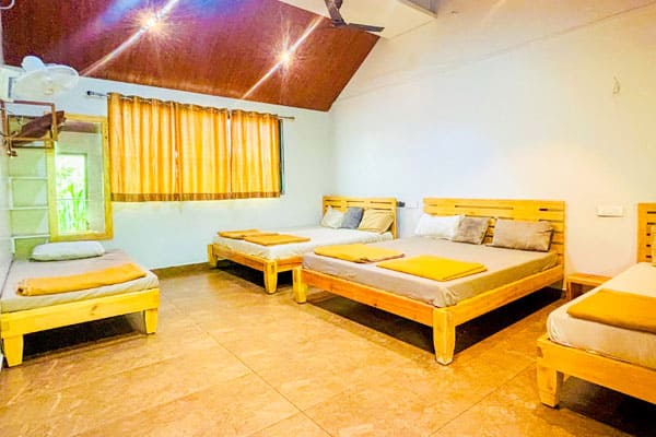 Dormitory Room accommodating 8–9 guests with AC and non-AC options and attached washroom at Andur Lakeview Resort