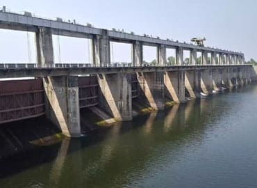 Lakhmapur Dam surrounded by greenery near Andur